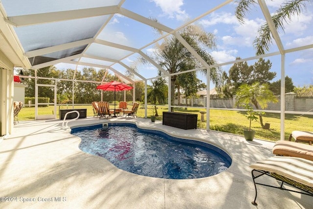 view of pool featuring a patio, a lanai, and a lawn