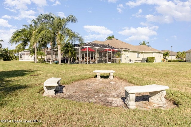 view of yard with a lanai