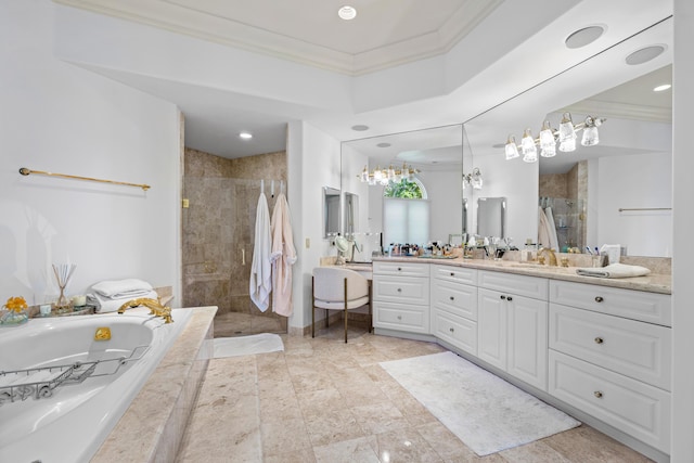 bathroom with vanity, crown molding, and independent shower and bath