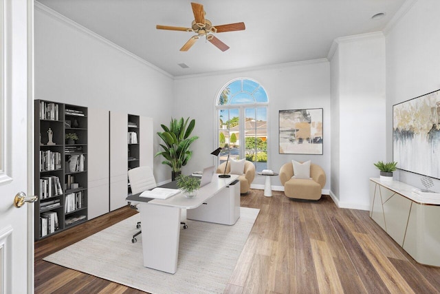 home office with hardwood / wood-style flooring, crown molding, and ceiling fan