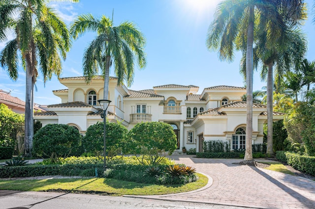 mediterranean / spanish-style house with a balcony