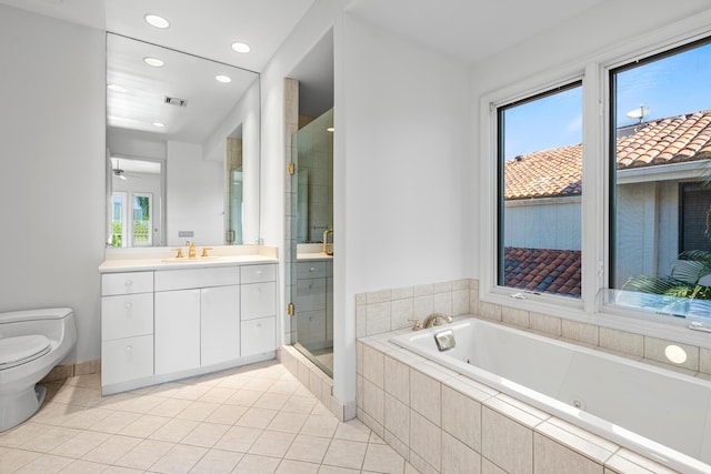 full bathroom featuring tile patterned flooring, vanity, separate shower and tub, and toilet