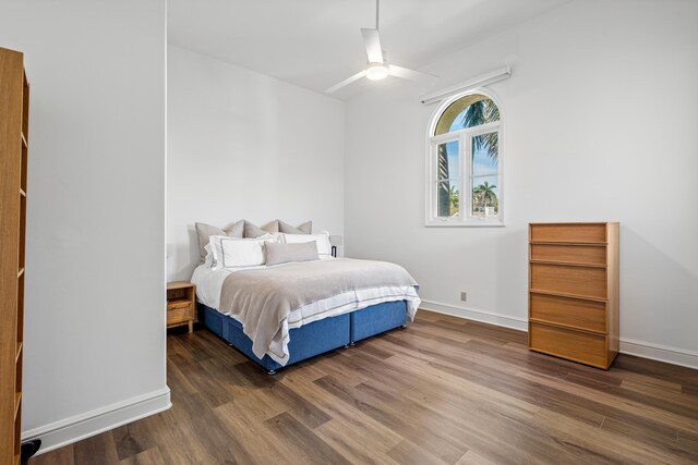 bedroom featuring ceiling fan and dark hardwood / wood-style floors