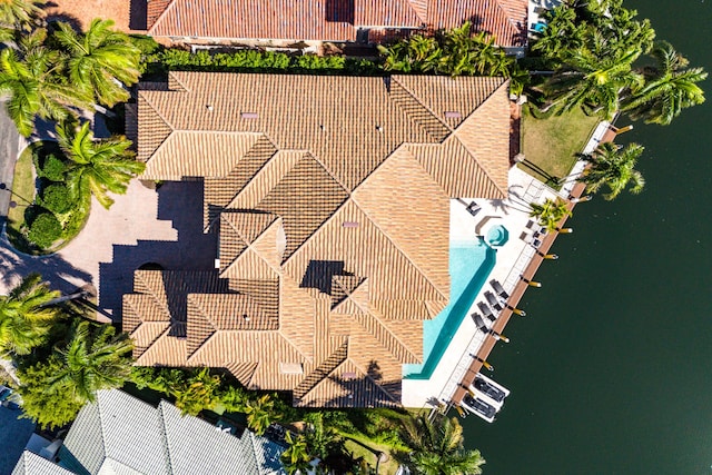 birds eye view of property featuring a water view