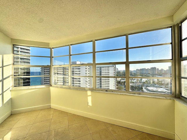 unfurnished sunroom with a wealth of natural light