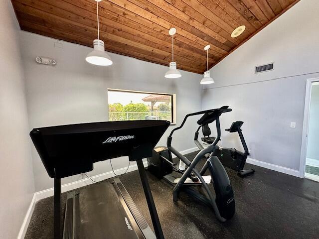 exercise area featuring lofted ceiling and wood ceiling