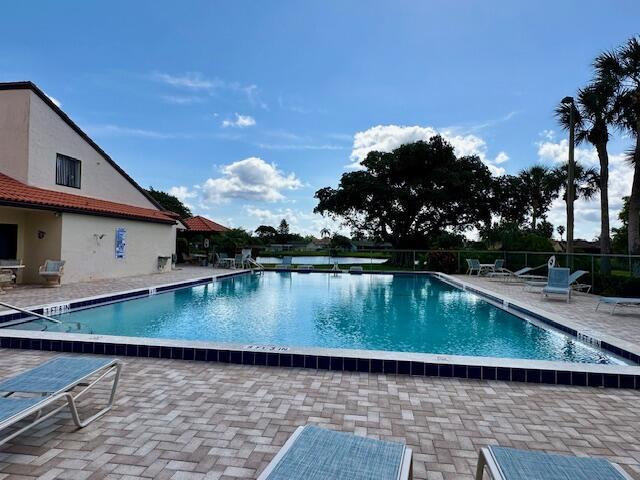 view of swimming pool with a patio area