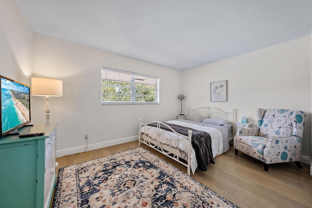 bedroom with hardwood / wood-style flooring