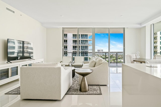 living room featuring floor to ceiling windows and light tile patterned floors