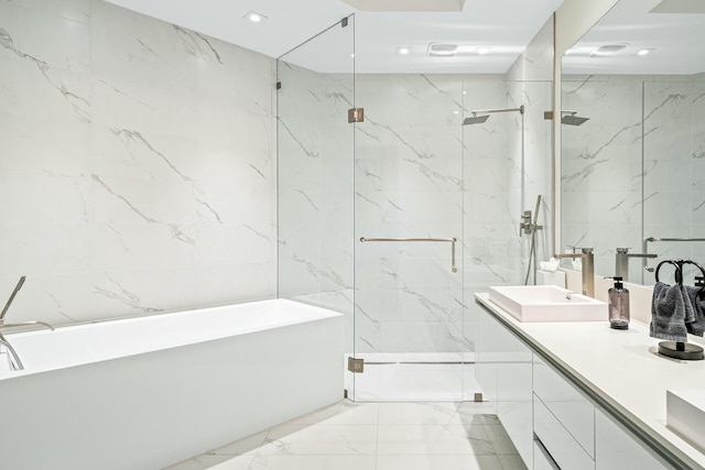 bathroom with independent shower and bath, vanity, and tile walls