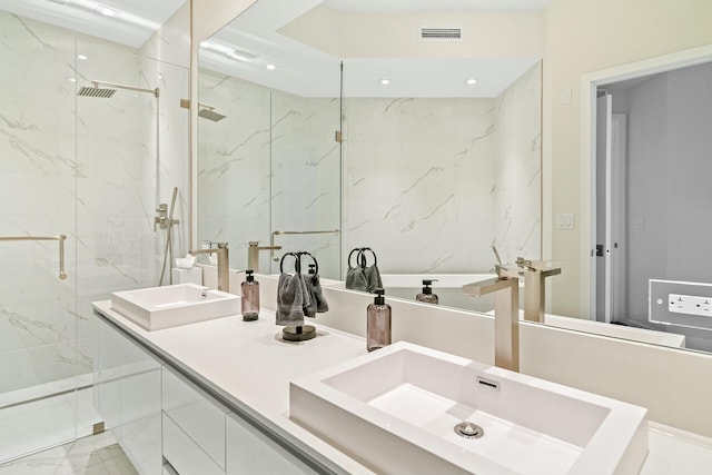 bathroom featuring vanity and a shower with door