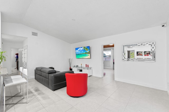 tiled living room with lofted ceiling