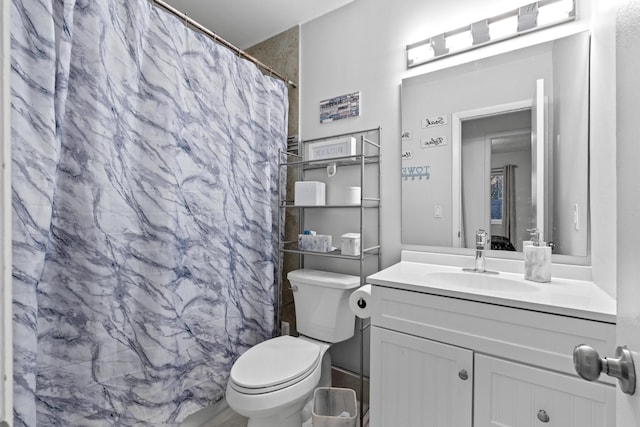 bathroom with vanity, toilet, and a shower with shower curtain