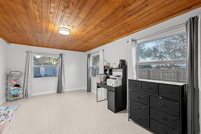 interior space with light tile patterned flooring and wood ceiling