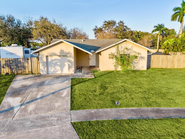 ranch-style home with a garage and a front yard