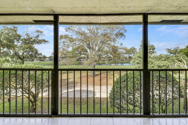 exterior space with a water view and plenty of natural light