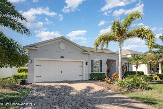 ranch-style home featuring a garage