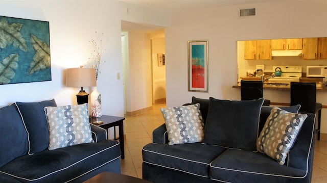 living room with light tile patterned floors