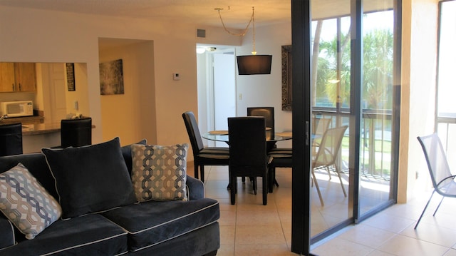 tiled dining space with expansive windows