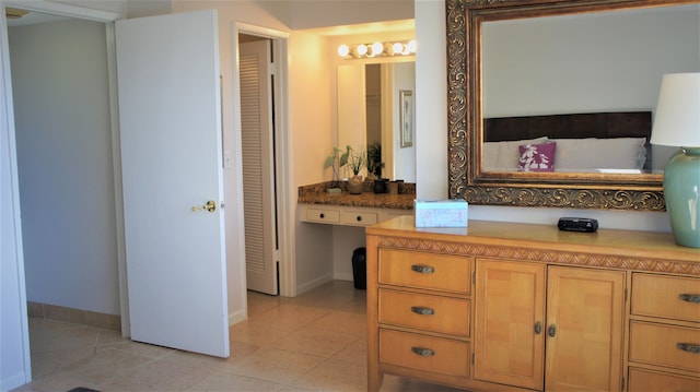 bathroom with tile patterned flooring