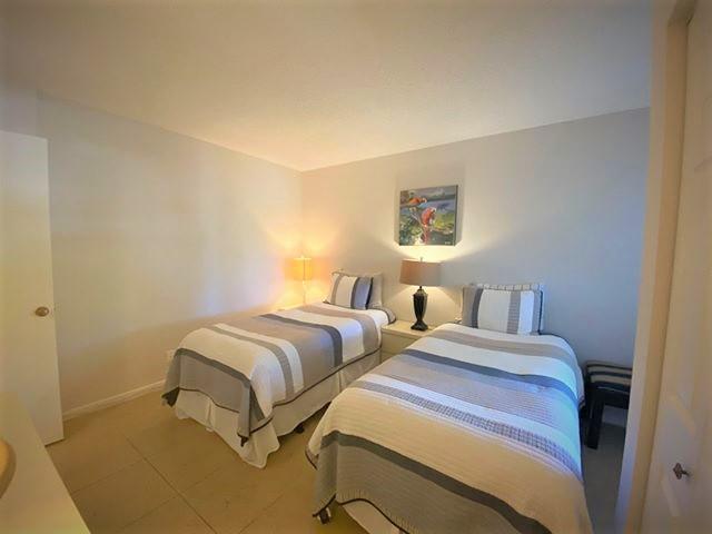 bedroom with light tile patterned flooring