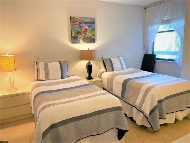 bedroom with light tile patterned floors