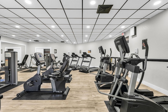 exercise room with hardwood / wood-style flooring