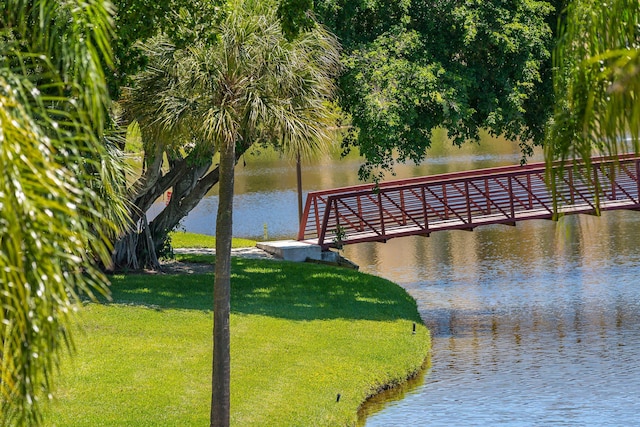 exterior space featuring a water view and a lawn