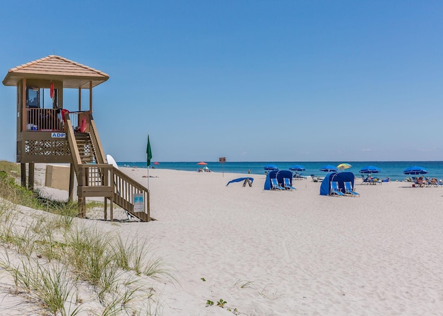 property view of water featuring a beach view