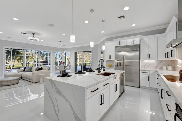 11960 Torreyanna Cir, West Palm Beach, FL 33412 - kitchen with stainless steel appliances, a sink, recessed lighting, crown molding, and white cabinetry