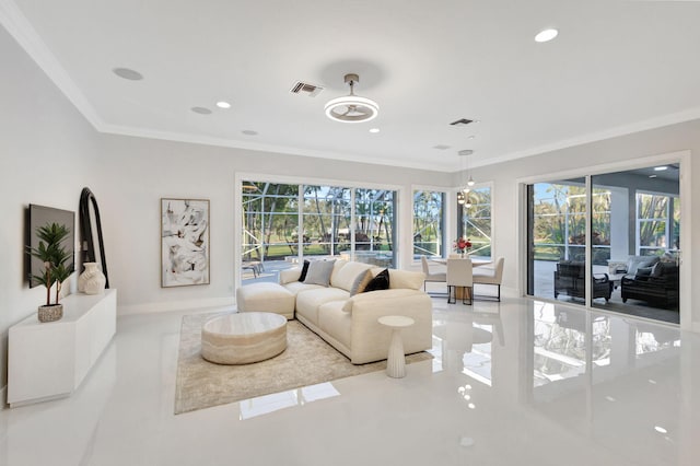 living room with ornamental molding and a wealth of natural light