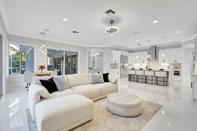 11960 Torreyanna Cir, West Palm Beach, FL 33412 - living area featuring ornamental molding, recessed lighting, and baseboards