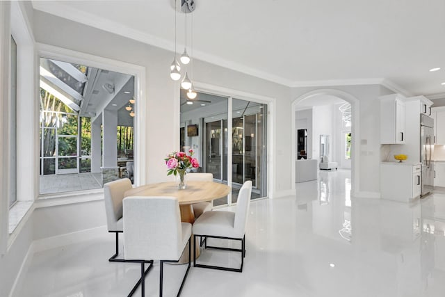 dining area with crown molding