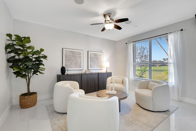 sitting room featuring ceiling fan