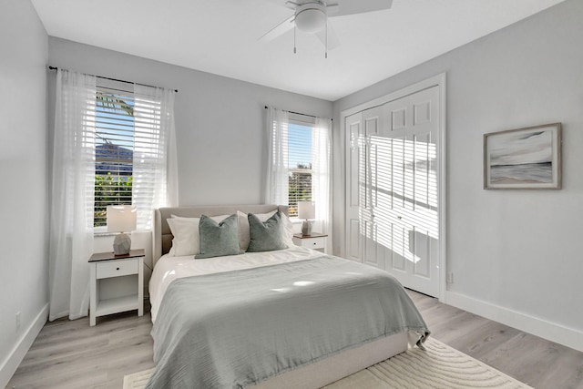 bedroom featuring light wood-type flooring and ceiling fan