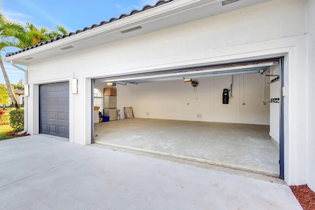 garage featuring fridge