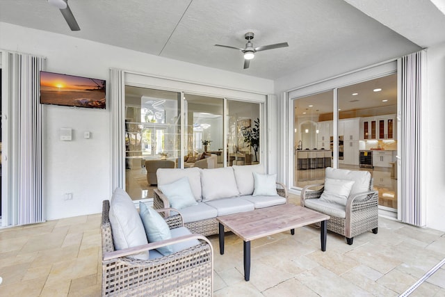 view of patio with an outdoor hangout area, ceiling fan, and wine cooler