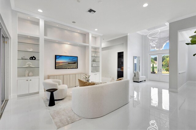 11960 Torreyanna Cir, West Palm Beach, FL 33412 - living room with built in features, crown molding, light tile patterned floors, french doors, and recessed lighting