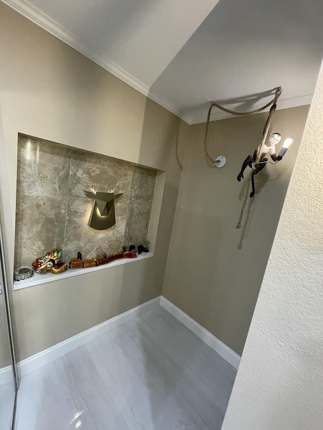 bathroom featuring ornamental molding