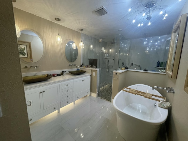 bathroom with vanity and separate shower and tub