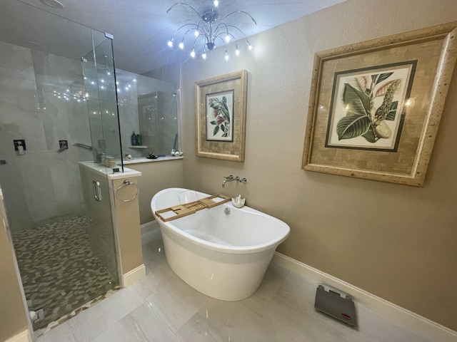 bathroom with shower with separate bathtub