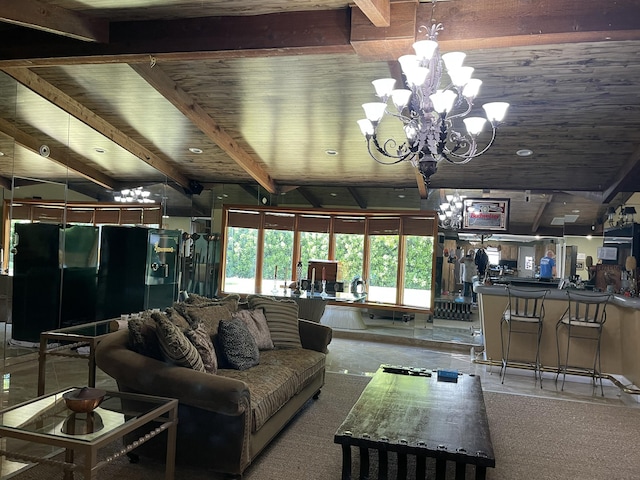 living room featuring beamed ceiling and a notable chandelier