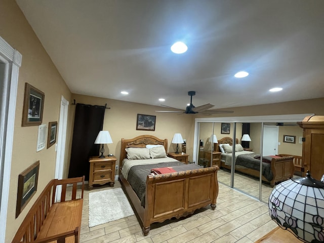 bedroom with ceiling fan and light hardwood / wood-style floors