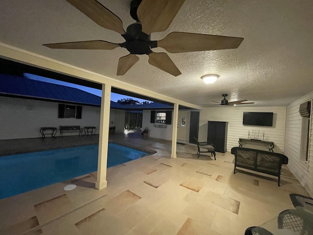 view of pool featuring ceiling fan