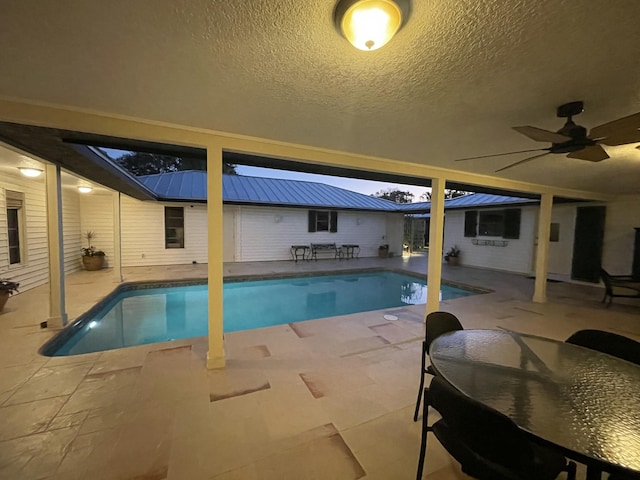 view of pool with a patio and ceiling fan