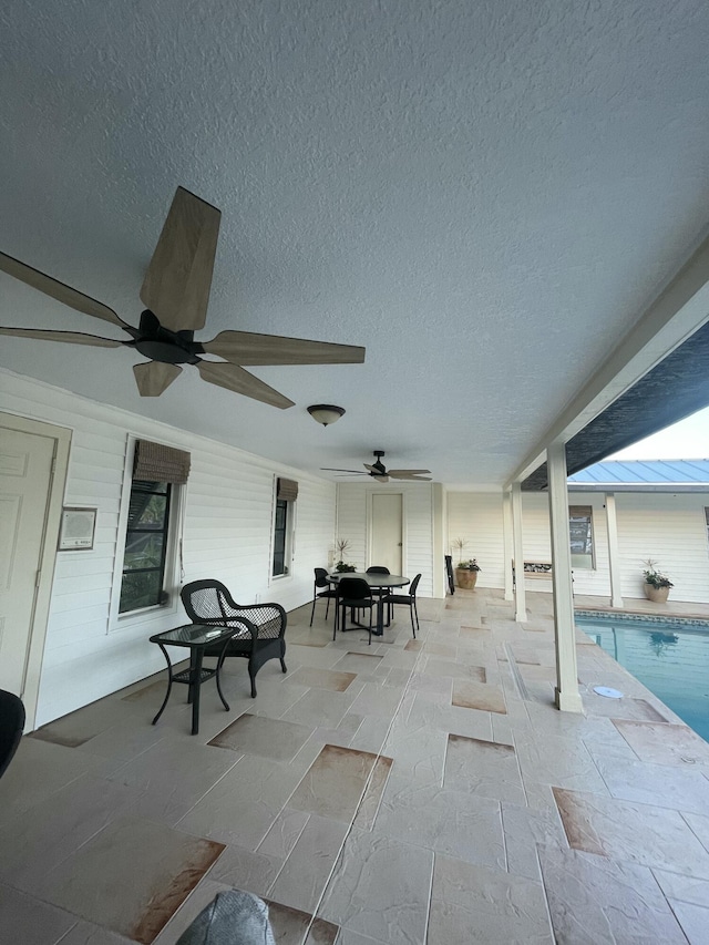 view of patio featuring ceiling fan