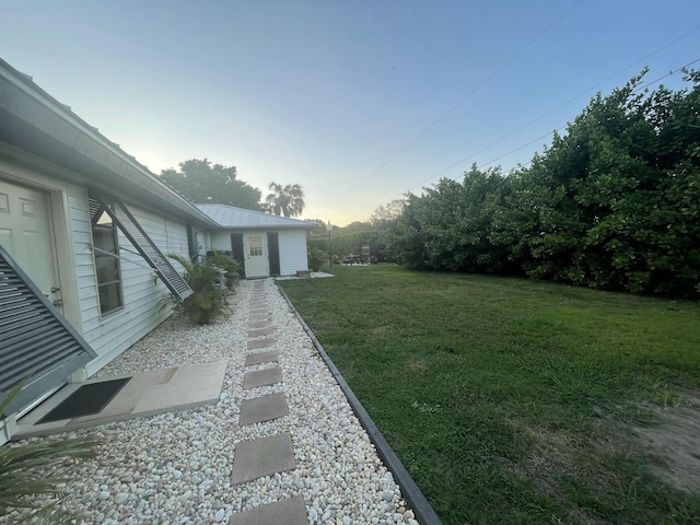 view of yard at dusk