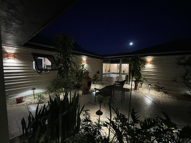 view of patio at night