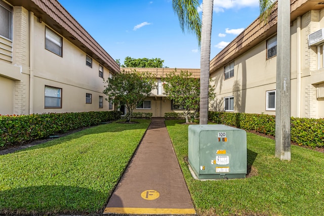 view of home's community featuring a lawn