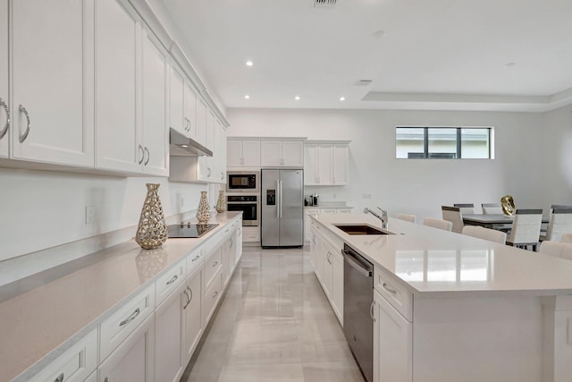 kitchen with white cabinetry, sink, an island with sink, and black appliances